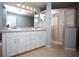 Modern bathroom features a dual sink vanity and tiled walk-in shower at 3705 Bruton, Plant City, FL 33565