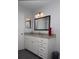 Well-lit bathroom vanity features granite counters and classic white cabinetry at 3705 Bruton, Plant City, FL 33565