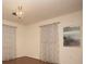 Light-filled bedroom with hardwood floors, classic chandelier, and neutral tones at 3705 Bruton, Plant City, FL 33565