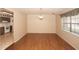 Open dining room with hardwood floors, a window, and views to the kitchen area at 3705 Bruton, Plant City, FL 33565