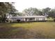 Single story brick house with shutters and a well kept lawn at 3705 Bruton, Plant City, FL 33565