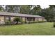 Charming brick home featuring a well-maintained lawn and lush landscaping at 3705 Bruton, Plant City, FL 33565
