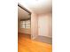 Welcoming foyer with hardwood floors and a white entry door, showcasing natural light at 3705 Bruton, Plant City, FL 33565