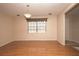 Bright living room featuring hardwood floors, a large window, and neutral wall color at 3705 Bruton, Plant City, FL 33565