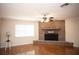 A living room featuring a brick fireplace and hardwood floors at 3705 Bruton, Plant City, FL 33565
