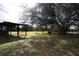 Picturesque pasture view with grazing cattle and a wooden shelter under a large tree at 3705 Bruton, Plant City, FL 33565