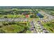 An aerial view shows a serene community with manicured lawns and beautiful homes at 3935 Capri Coast Dr, Plant City, FL 33565