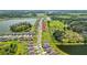 This aerial showcases the neighborhood layout of homes and green spaces, ideal for suburban living at 3935 Capri Coast Dr, Plant City, FL 33565