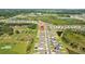 A high aerial showcases the community layout of homes, ponds, and green spaces at 3935 Capri Coast Dr, Plant City, FL 33565