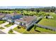 Expansive view of a well-maintained home featuring a landscaped yard and a fenced backyard at 3935 Capri Coast Dr, Plant City, FL 33565