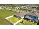 Residential neighborhood aerial view showcasing backyard fencing and nearby landscaping at 3935 Capri Coast Dr, Plant City, FL 33565