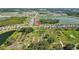 An aerial view shows a serene community surrounded by multiple lakes at 3935 Capri Coast Dr, Plant City, FL 33565