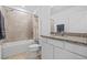 Well-lit bathroom with a granite vanity top, shower, and toilet at 3935 Capri Coast Dr, Plant City, FL 33565