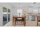 Eat-in dining area situated off of the kitchen with outdoor access and a modern chandelier at 3935 Capri Coast Dr, Plant City, FL 33565