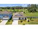 Charming single-Gathering home with well-maintained landscaping, a two-car garage, and a welcoming facade at 3935 Capri Coast Dr, Plant City, FL 33565