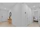 Bright hallway with tile flooring, neutral walls and adjacent bedroom and entry at 3935 Capri Coast Dr, Plant City, FL 33565