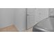 Spacious laundry room with tile flooring and access to the rest of the home at 3935 Capri Coast Dr, Plant City, FL 33565