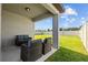 Inviting outdoor space with patio seating and a tranquil view of the lush backyard at 3935 Capri Coast Dr, Plant City, FL 33565
