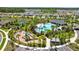 Aerial view showcasing the community pool, playground, tennis court, and other outdoor amenities at 3935 Capri Coast Dr, Plant City, FL 33565