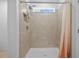 Nicely tiled shower with a shower head and window to allow for additional natural light at 3935 Capri Coast Dr, Plant City, FL 33565