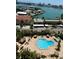 Aerial view of the pool, recreation area, and amenities at this waterfront condo community at 400 Island Way # 1402, Clearwater Beach, FL 33767