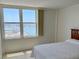 Bedroom featuring large windows with great water views at 400 Island Way # 1402, Clearwater Beach, FL 33767