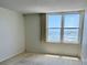 Bedroom featuring large windows with great water views at 400 Island Way # 1402, Clearwater Beach, FL 33767