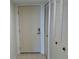 Front door next to linen closet at 400 Island Way # 1402, Clearwater Beach, FL 33767