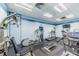 Well-equipped gym space with treadmills, elliptical machines, and weight training equipment for residents at 400 Island Way # 1402, Clearwater Beach, FL 33767
