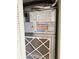 Close up of a well-maintained HVAC system with visible filter and detailed safety and operation labels at 400 Island Way # 1402, Clearwater Beach, FL 33767