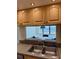 Kitchen sink view to dining area and water view from this light, airy condo at 400 Island Way # 1402, Clearwater Beach, FL 33767