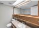 Bathroom featuring a large mirror, vanity with sink, and adjacent toilet at 4299 Bellaire Dr, Hernando Beach, FL 34607