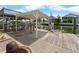 Spacious covered dock and boat lift on the water with a surfboard table, perfect for entertaining at 4299 Bellaire Dr, Hernando Beach, FL 34607