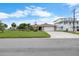 Charming single-story home with a large front yard, a driveway, and a two-car garage at 4299 Bellaire Dr, Hernando Beach, FL 34607