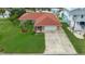 Charming single-story home with well-manicured lawn, a spacious driveway, and an attached one car garage at 4299 Bellaire Dr, Hernando Beach, FL 34607