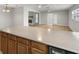 Open kitchen with stainless steel appliances and views of the living room with fireplace at 4299 Bellaire Dr, Hernando Beach, FL 34607