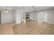 Spacious living room showcasing wood and tile flooring, fireplace and seamless flow for entertaining at 4299 Bellaire Dr, Hernando Beach, FL 34607