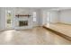 Bright living room with a stone fireplace and tile flooring, ideal for relaxation and gatherings at 4299 Bellaire Dr, Hernando Beach, FL 34607