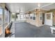 Bright screened porch with a view of the neighborhood and canal at 4299 Bellaire Dr, Hernando Beach, FL 34607