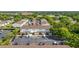 Aerial view of a well-maintained townhouse complex featuring dedicated parking and lush landscaping at 4314 La Mora Ct, Tampa, FL 33611
