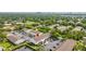 Aerial view of a townhouse community highlighting ample parking, mature trees, and proximity to amenities at 4314 La Mora Ct, Tampa, FL 33611
