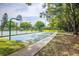 Outdoor basketball court surrounded by lush greenery, offering a great recreational space at 4314 La Mora Ct, Tampa, FL 33611