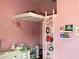 Charming bedroom featuring custom built-in loft area with ladder and pink decor at 4314 La Mora Ct, Tampa, FL 33611