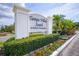 Welcoming community sign for Tampa Villas South surrounded by lush landscaping and colorful flowers at 4314 La Mora Ct, Tampa, FL 33611