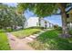 Inviting two-story home with a well-manicured lawn and walkway leading to the entrance at 4314 La Mora Ct, Tampa, FL 33611