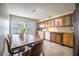 Inviting kitchen with a wooden dining table, tile floors, and ample counter space at 4314 La Mora Ct, Tampa, FL 33611