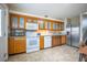Well-lit kitchen with wooden cabinets, modern appliances, and a view of the backyard at 4314 La Mora Ct, Tampa, FL 33611