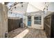 Cozy outdoor patio space with brick pavers, string lights, privacy fence and access to home and storage unit at 4314 La Mora Ct, Tampa, FL 33611