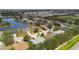 Scenic aerial view of a charming community with lush landscaping, serene lake, and well-maintained homes at 4612 35Th E Ave, Palmetto, FL 34221