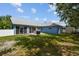 Beautiful backyard featuring a well-maintained lawn, patio area, and sliding glass doors at 4612 35Th E Ave, Palmetto, FL 34221